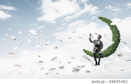 Young businessman or student studying the science and paper planes fly around Young businessman or student studying the science and paper planes fly around 68685462