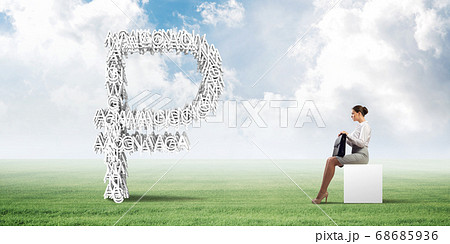 Attractive business lady or accountant outdoors on white box Attractive business lady or accountant outdoors on white box 68685936