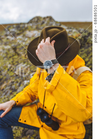 young backpacker sitting on the rock having a rest 68686501