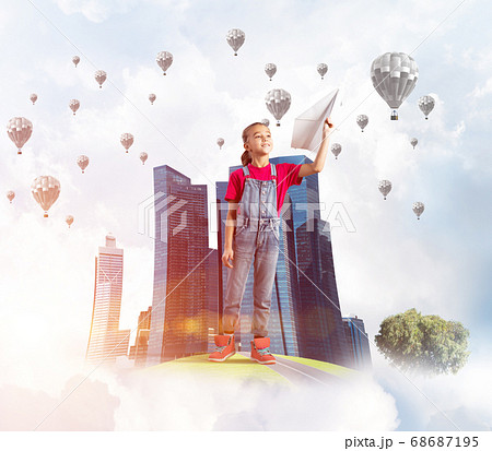 Concept of careless happy childhood with girl dreaming about future 68687195