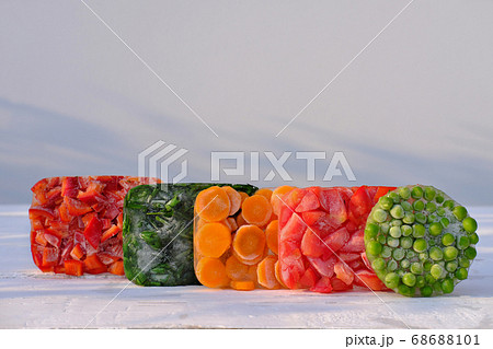 Frozen vegetables on a wooden table . side view. Frozen vegetables on a wooden table . side view. 68688101