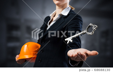 Real estate agent holds in palm 3d key Real estate agent holds in palm 3d key 68688130