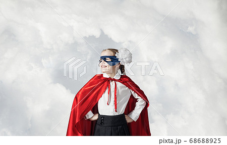 Girl power concept with cute kid guardian against sky background 68688925