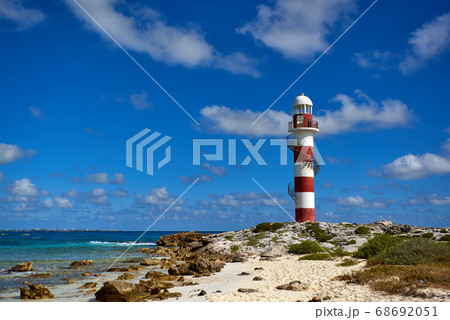 Lighthouse on a rocky shore in Cancun. Clear sky Lighthouse on a rocky shore in Cancun. Clear sky 68692051
