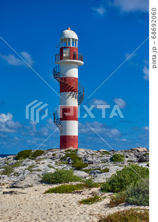 Lighthouse on a rocky shore in Cancun. Clear sky Lighthouse on a rocky shore in Cancun. Clear sky 68692060