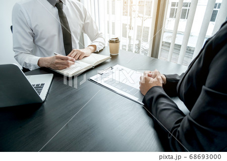 Business people hold a job profile and talk to job applicants for job interviews about careers 68693000