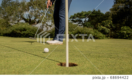 Close-up of a golf hole Close-up of a golf hole 68694422