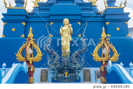 Gold Phra Sivali or Phra Sivalee Buddhist Monk Statue and Serpent or Naga in Zoom View 68696180