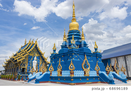 Blue Yellow Pagoda and Church of Wat Rong Suea Ten at Chiangrai Thailand 68696189
