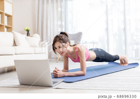 woman doing exercise at home 68696330