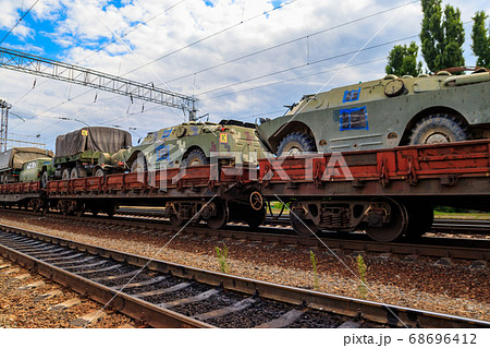 Cargo train carrying military vehicles Cargo train carrying military vehicles 68696412