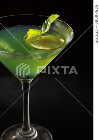 Kiwi jelly with lime pieces in the glass topped Kiwi jelly with lime pieces in the glass topped 68697605