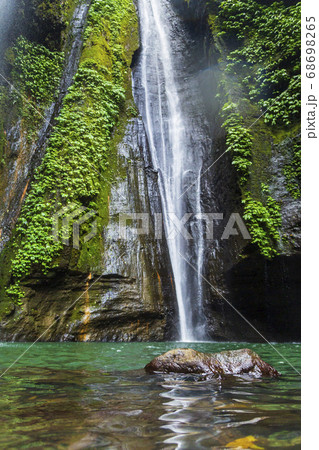 Sekumpul Waterfalls surrounded by tropical forest 68698265