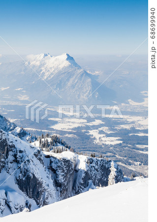The view from the summit of Untersberg mountain in Austria. Untersberg straddles the German border and two mountains, Zwiesel in Bavaria, Germany and Staufen in Austria can be seen in the background. The view from the summit of Untersberg mountain in Austria. Untersberg straddles the German border and two mountains, Zwiesel in Bavaria, Germany and Staufen in Austria can be seen in the background. 68699940