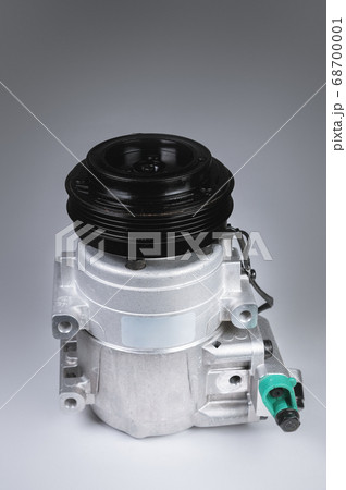 New car freon compressor for air conditioner on gray background 68700001