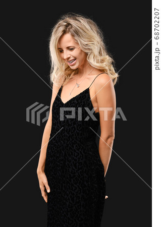 Charming young woman with curly hair Charming young woman with curly hair 68702207