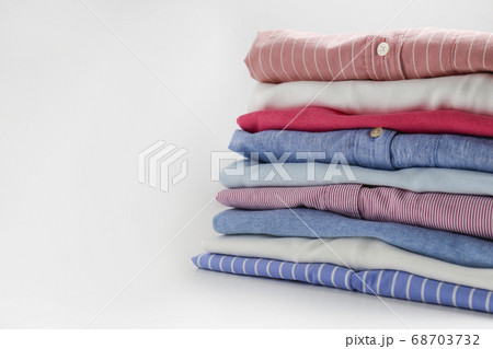 Clean garment neatly folded after laundry over Clean garment neatly folded after laundry over 68703732