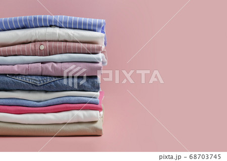 Clean garment neatly folded after laundry over Clean garment neatly folded after laundry over 68703745