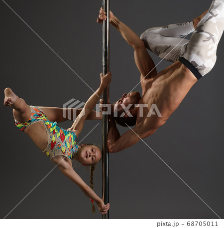 Pole dancers making exercises in pair studio shot 68705011
