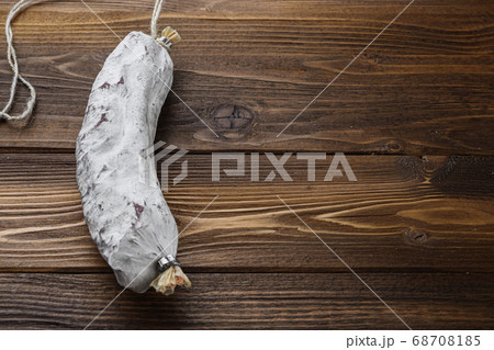 Salchichon sausage on light wooden background with copy space 68708185