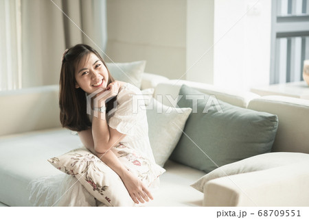 portrait of beautiful girl sitting on the sofa in 68709551