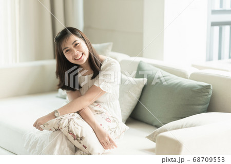 portrait of beautiful girl sitting on the sofa in 68709553