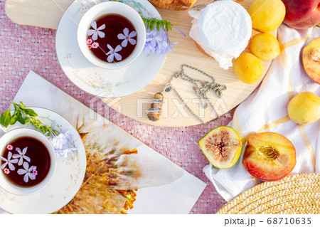 A picnic at dawn in gentle colors. 68710635