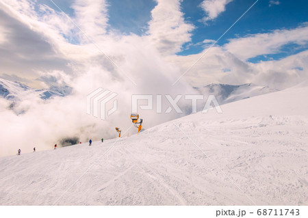 Saalbach, Austria ski slope and snow peaks panorama 68711743