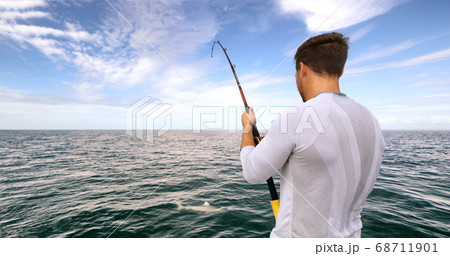Shark fishing activity on fisherman boat in Florida. Travel tourist man catch and release of spinner shark Shark fishing activity on fisherman boat in Florida. Travel tourist man catch and release of spinner shark 68711901