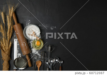 fresh eggs and cake flour  with kitchen utensils 68712087