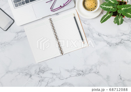 Blank notebook and Laptop with hot coffee on Blank notebook and Laptop with hot coffee on 68712088