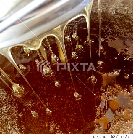 Background texture, dropping drops of sweet honey 68715427