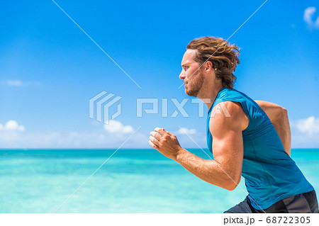 Healthy sport runner man running sprint on beach 68722305