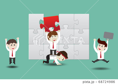 Teamwork, businessmen assembling pieces of a 68724986