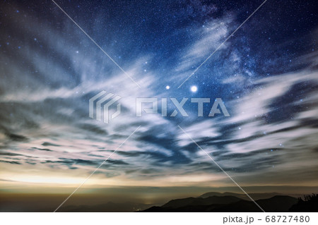 雲の上の星空の写真素材