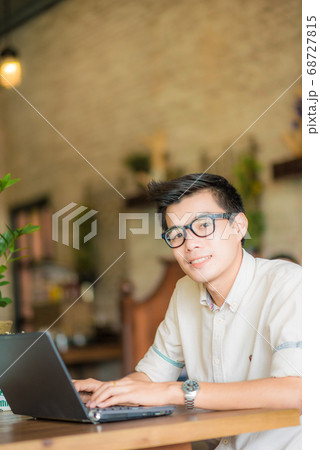 Happy young smart business man working tith laptop Happy young smart business man working tith laptop 68727815