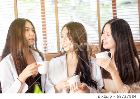 Group of asian girl having fun in home with coffee 68727984