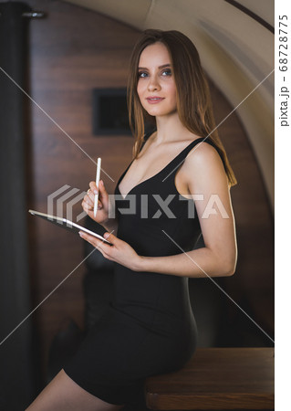 Attractive woman in private jet 68728775