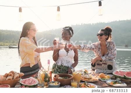 Woman toasting with wine 68733313