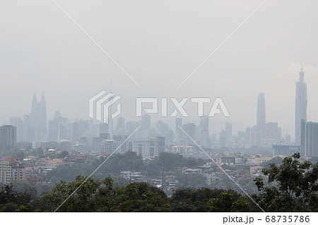 Hazy Kuala Lumpur city skyscape due to  haze from 68735786