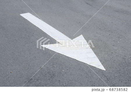Arrow road marking made from thermoplastic. Signage show direction for the road users.  68738582