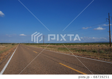 A long straight Route 66 road between Texas and New Mexico, USA. August 4, 2007. 68739251