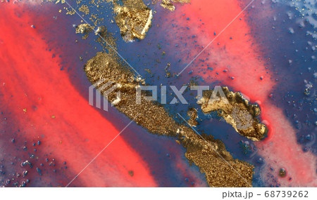 Piles of gold sequins on pink smudges of paint. Abstract pattern. 68739262