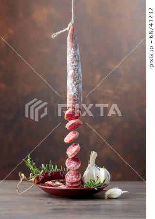 Dry-cured sausage with rosemary, garlic and 68741232