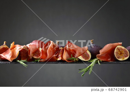 Prosciutto with figs and rosemary. 68742901