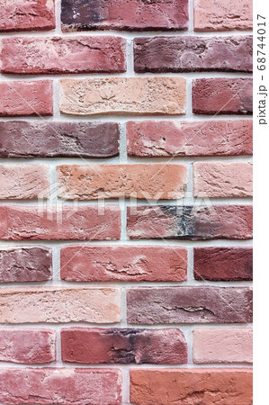 The background of the wall is a red brick surface. Abstract wall background 68744017