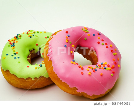 pink and green donuts isolated on white background pink and green donuts isolated on white background 68744035