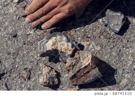 Pieces of semi precious gemstones druses on the ground Selective focus 68745310