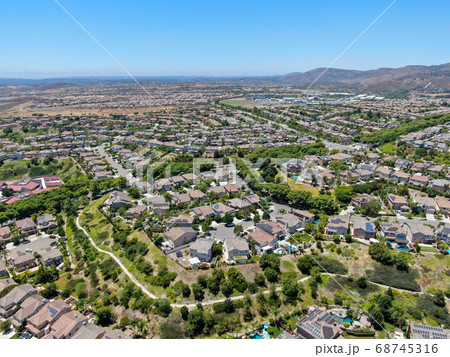 Aerial view of suburban neighborhood with big mansions in San Diego 68745316