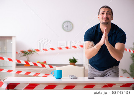 Young man at home in self-isolation concept 68745433